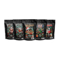 There are five four ounce bags of coffee. From left to right the coffee bag names are Jingle Bones, White Chocolate Peppermint Bark, Toffee Almond Crunch, Sugar Rush, and Horchata.