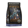 The front of a 12 ounce bag of Bones Coffee Company Army of Dark Chocolate coffee. Its flavor is dark chocolate, and it has a skeleton wielding a chainsaw standing on dark chocolate with a woman clinging to its leg on the art.