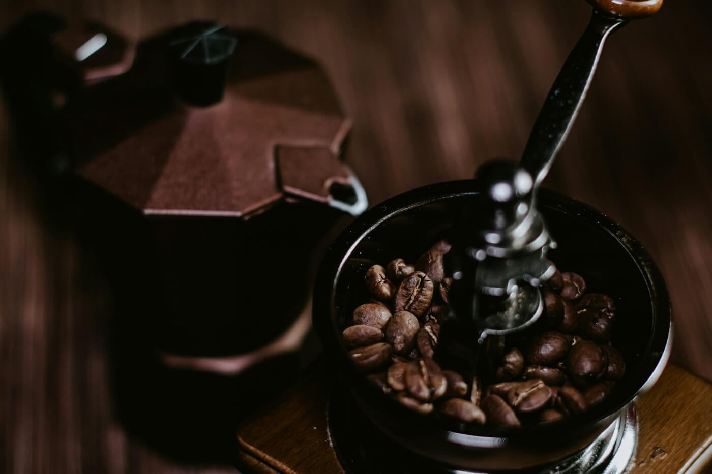 coffee beans in manual coffee grinder