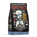 The front of a 12 ounce bag of Bones Coffee Company French Toast coffee. Its flavor is french toast, and it has a skeleton wearing a chef’s coat and hat holding up a plate of fresh french toast on the art.