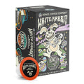 The front of the Bones Coffee Company White Rabbit 12 Count Bones Cups box. Its flavor is white chocolate. It has a skeleton being carried by a white chocolate rabbit through a field of easter egg on its art.