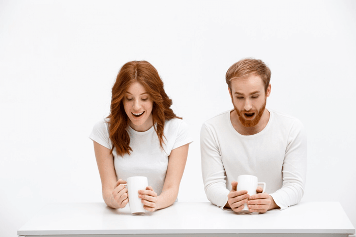 man and woman surprised with their own mugs